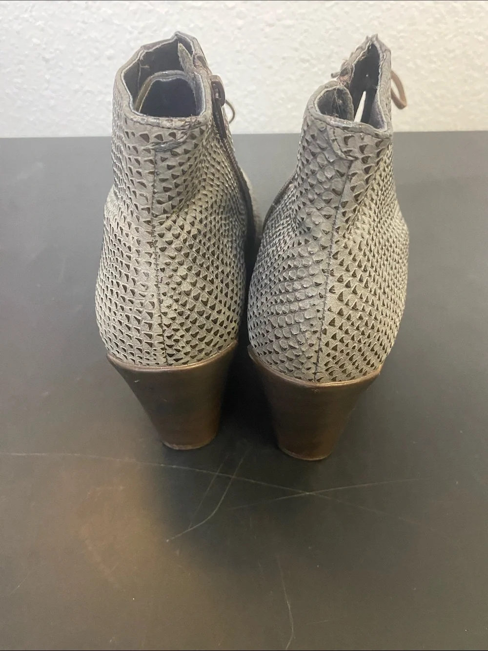 The boots in the image are the Naot Nadine Wedge Bootie,